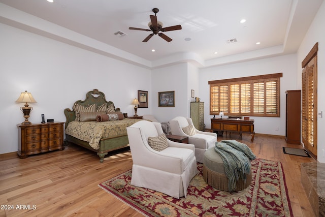 bedroom with ceiling fan and light wood-type flooring