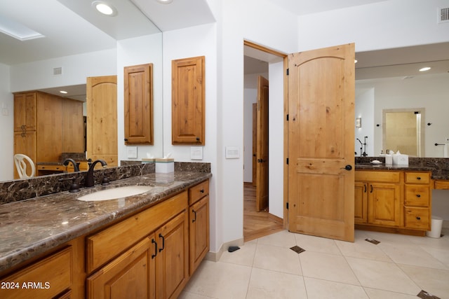 bathroom featuring tile patterned floors and vanity