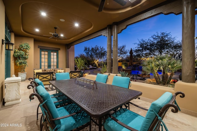 patio terrace at dusk with ceiling fan