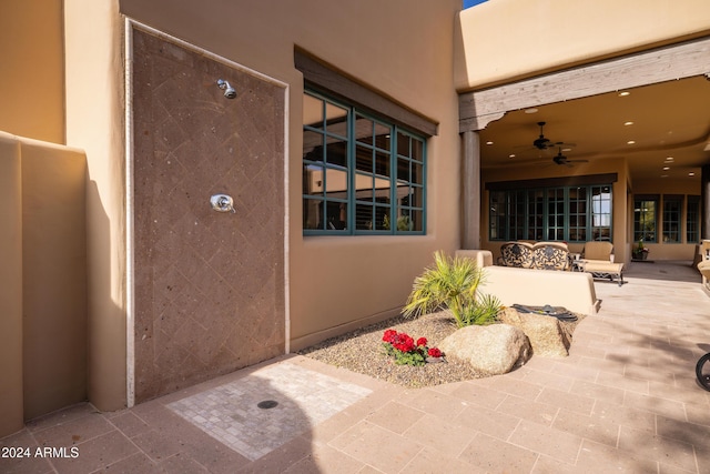 view of patio / terrace featuring ceiling fan