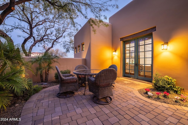 patio terrace at dusk with french doors