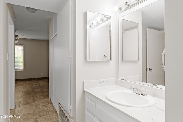 bathroom featuring vanity and ceiling fan