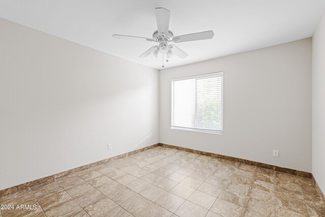 spare room with ceiling fan