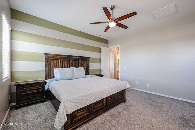bedroom featuring baseboards, light carpet, and visible vents