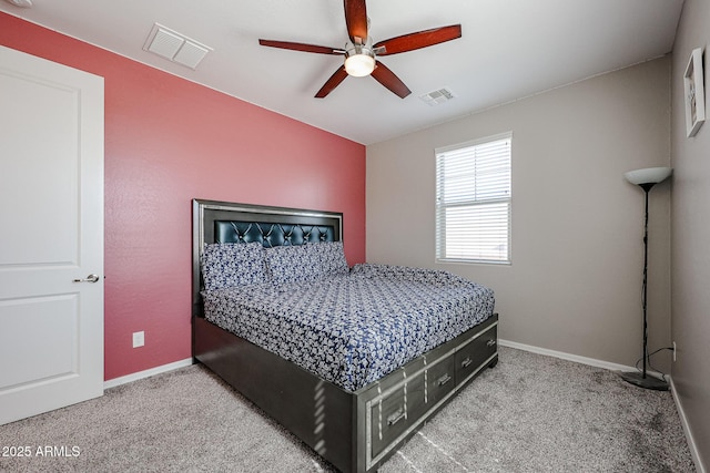 carpeted bedroom featuring visible vents, baseboards, and ceiling fan