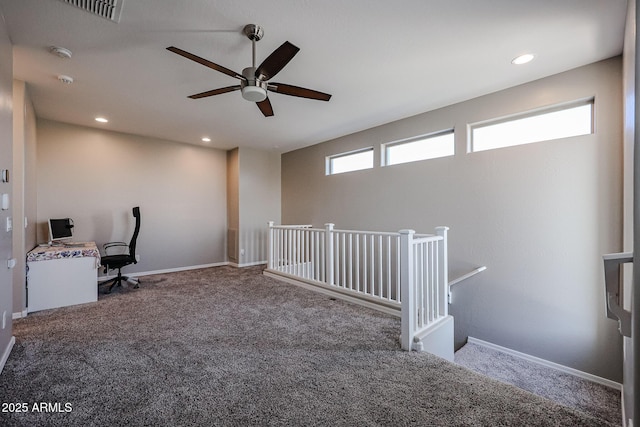 unfurnished office featuring visible vents, carpet flooring, a ceiling fan, and recessed lighting