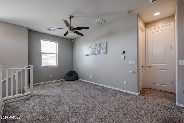 interior space with visible vents, carpet floors, and ceiling fan