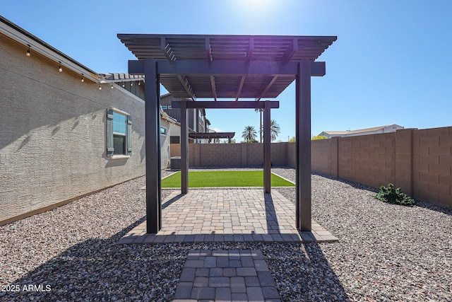 view of patio / terrace with a fenced backyard and a pergola