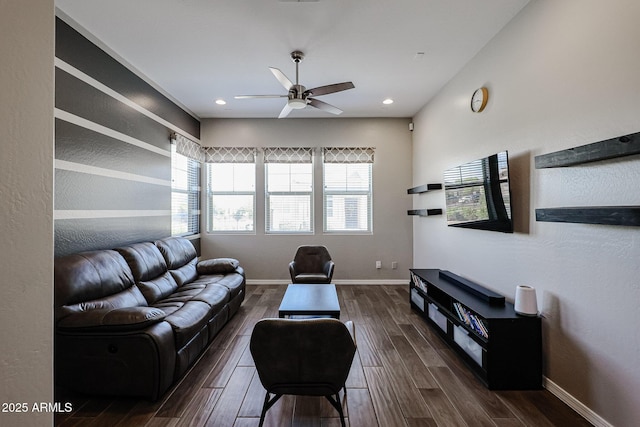 living room featuring recessed lighting, ceiling fan, baseboards, and dark wood-type flooring