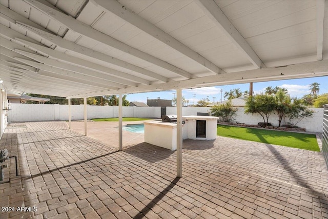 view of patio / terrace featuring area for grilling and an outdoor bar