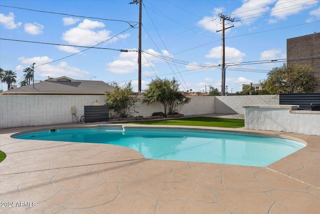 view of swimming pool featuring a patio area