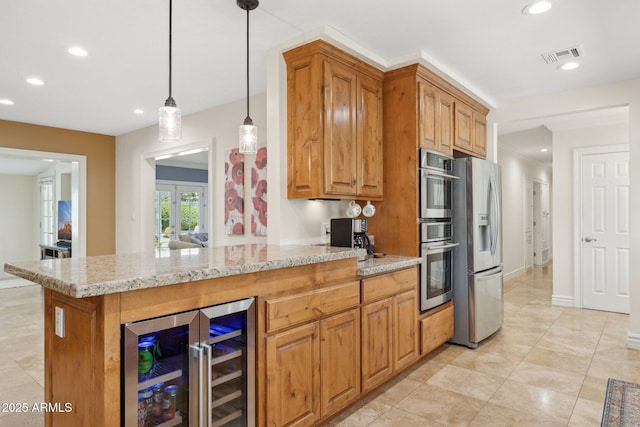 7042 N 13th St, Phoenix, AZ 85020 - kitchen featuring visible vents, recessed lighting, wine cooler, and stainless steel fridge with ice dispenser