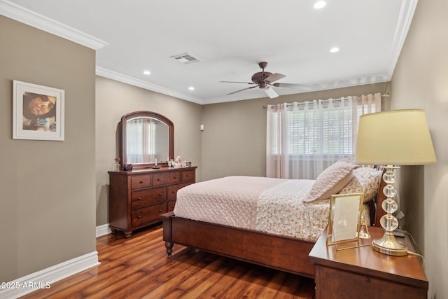 7042 N 13th St, Phoenix, AZ 85020 - bedroom featuring visible vents, ornamental molding, dark wood-style flooring, and multiple windows