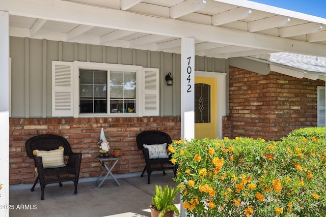 7042 N 13th St, Phoenix, AZ 85020 - entrance to property featuring brick siding and board and batten siding