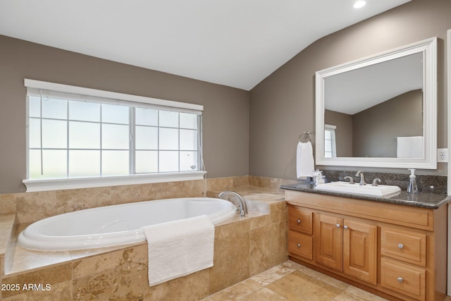 7042 N 13th St, Phoenix, AZ 85020 - full bathroom with lofted ceiling, a bath, and vanity