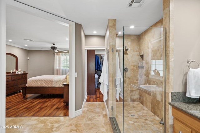 7042 N 13th St, Phoenix, AZ 85020 - bathroom featuring ceiling fan, visible vents, a shower stall, and vanity
