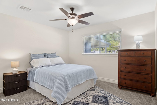 7042 N 13th St, Phoenix, AZ 85020 - bedroom with carpet flooring, a ceiling fan, baseboards, and visible vents