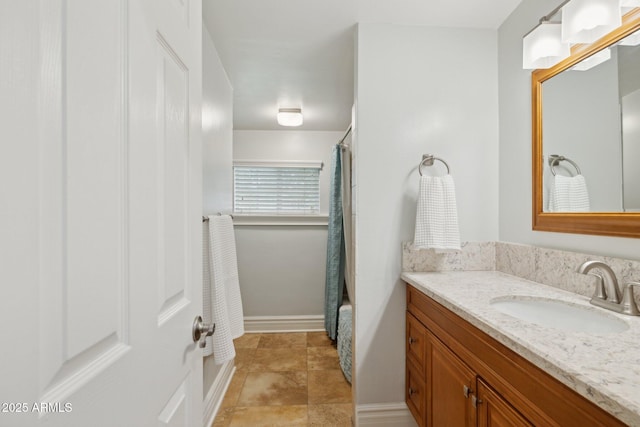 7042 N 13th St, Phoenix, AZ 85020 - full bathroom featuring vanity, baseboards, and a shower with shower curtain