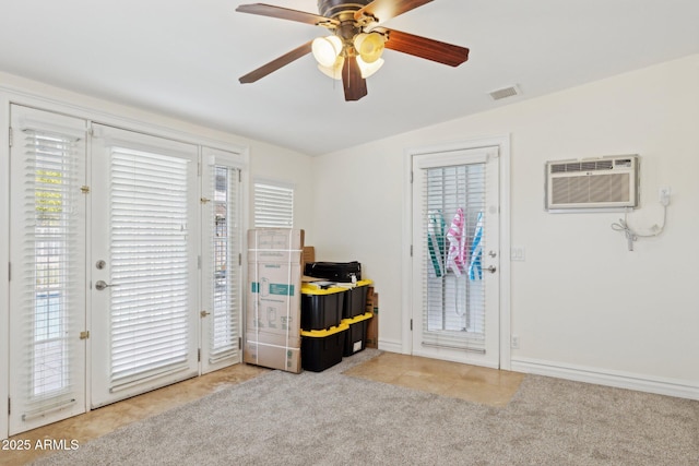 7042 N 13th St, Phoenix, AZ 85020 - interior space featuring access to outside, light colored carpet, baseboards, visible vents, and a wall mounted AC