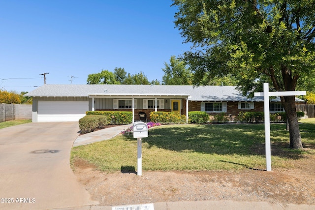 7042 N 13th St, Phoenix, AZ 85020 - ranch-style home featuring fence, driveway, a front yard, and a garage