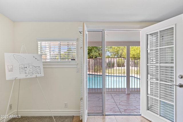 7042 N 13th St, Phoenix, AZ 85020 - entryway with baseboards and tile patterned floors