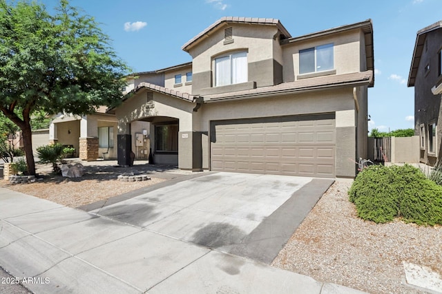 9420 S 35th Gln, Laveen, AZ 85339 - view of front facade featuring stucco siding, an attached garage, and driveway