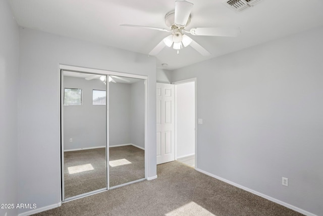 9420 S 35th Gln, Laveen, AZ 85339 - unfurnished bedroom with carpet flooring, a closet, baseboards, and ceiling fan
