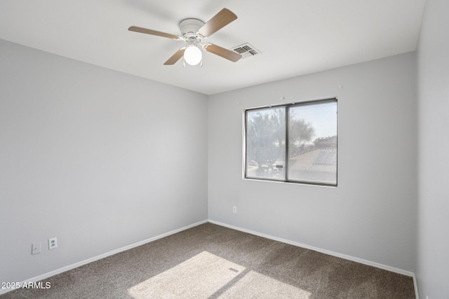 9420 S 35th Gln, Laveen, AZ 85339 - spare room with carpet, ceiling fan, and baseboards