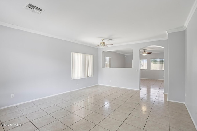 9420 S 35th Gln, Laveen, AZ 85339 - spare room featuring ceiling fan, ornamental molding, light tile patterned floors, arched walkways, and baseboards