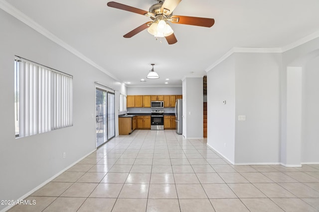 9420 S 35th Gln, Laveen, AZ 85339 - kitchen with appliances with stainless steel finishes, crown molding, brown cabinetry, ceiling fan, and dark countertops