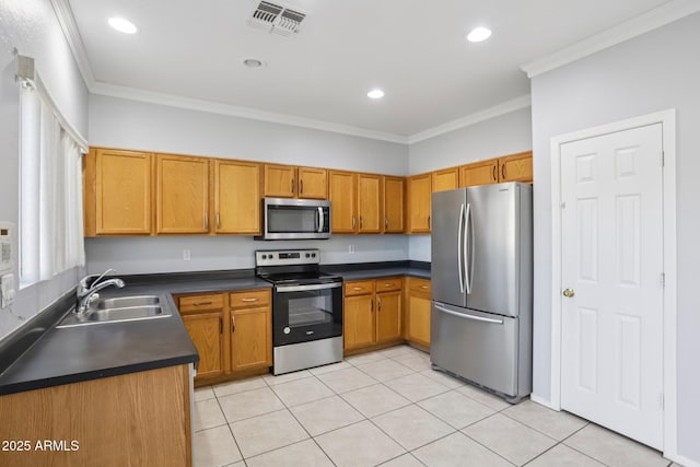 9420 S 35th Gln, Laveen, AZ 85339 - kitchen with appliances with stainless steel finishes, a sink, dark countertops, ornamental molding, and brown cabinets