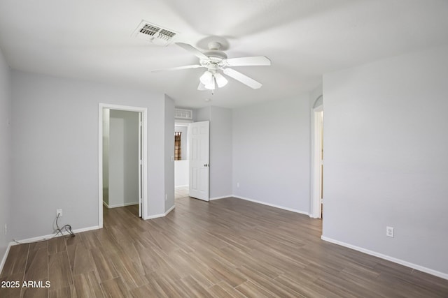 9420 S 35th Gln, Laveen, AZ 85339 - unfurnished room with a ceiling fan, wood finished floors, and baseboards