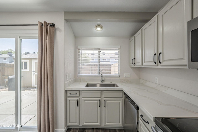 10101 N 91st Ave Unit 111, Peoria, AZ 85345 - kitchen featuring a sink, appliances with stainless steel finishes, healthy amount of natural light, and light stone counters
