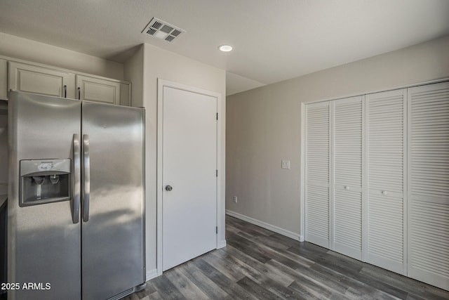 10101 N 91st Ave Unit 111, Peoria, AZ 85345 - kitchen with stainless steel fridge with ice dispenser, dark wood-style flooring, recessed lighting, and baseboards
