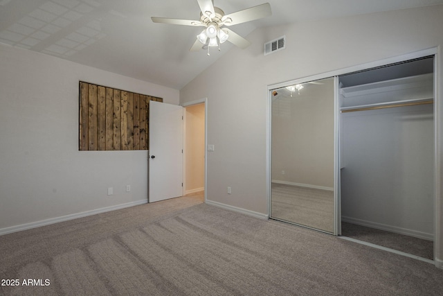 10101 N 91st Ave Unit 111, Peoria, AZ 85345 - unfurnished bedroom featuring carpet flooring, vaulted ceiling, baseboards, a closet, and a ceiling fan