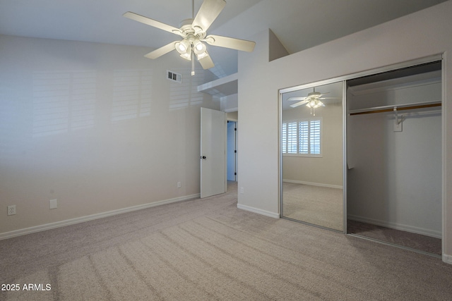 10101 N 91st Ave Unit 111, Peoria, AZ 85345 - unfurnished bedroom featuring carpet, a closet, ceiling fan, baseboards, and high vaulted ceiling