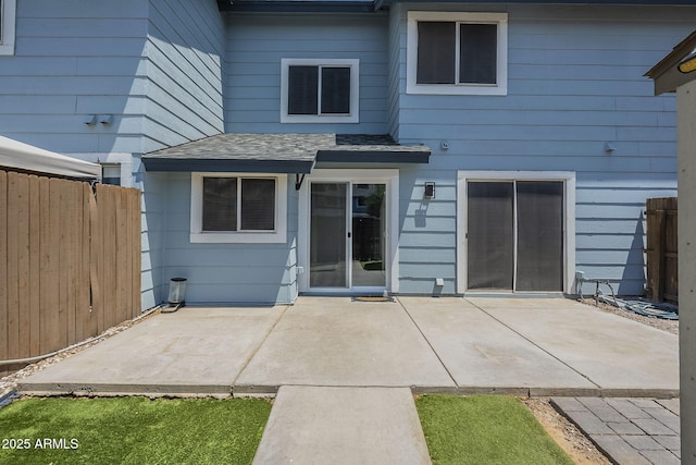 10101 N 91st Ave Unit 111, Peoria, AZ 85345 - back of property featuring a patio and a shingled roof