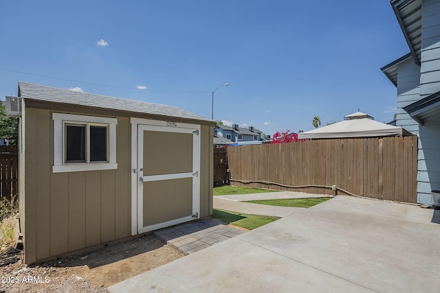 10101 N 91st Ave Unit 111, Peoria, AZ 85345 - view of shed with a fenced backyard and a gazebo