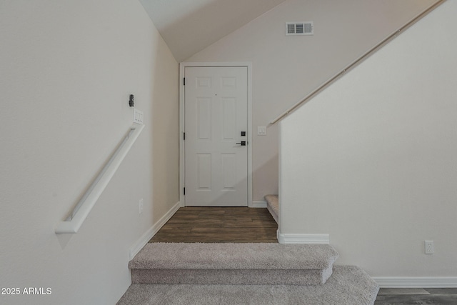 10101 N 91st Ave Unit 111, Peoria, AZ 85345 - stairway featuring wood finished floors, lofted ceiling, and baseboards