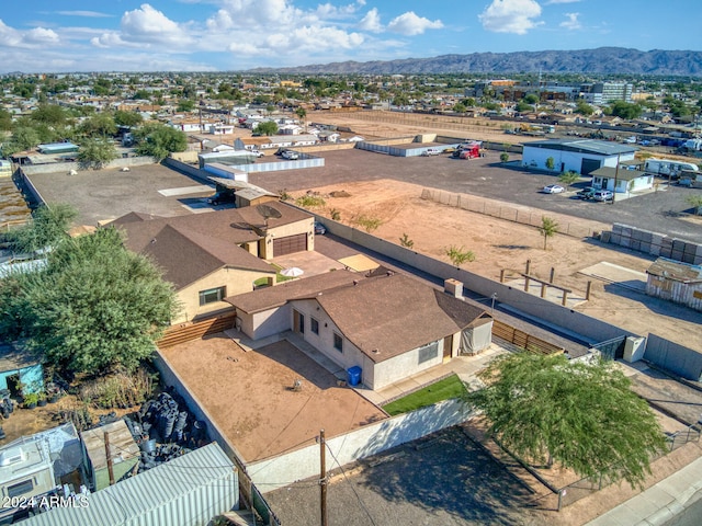 birds eye view of property with a mountain view