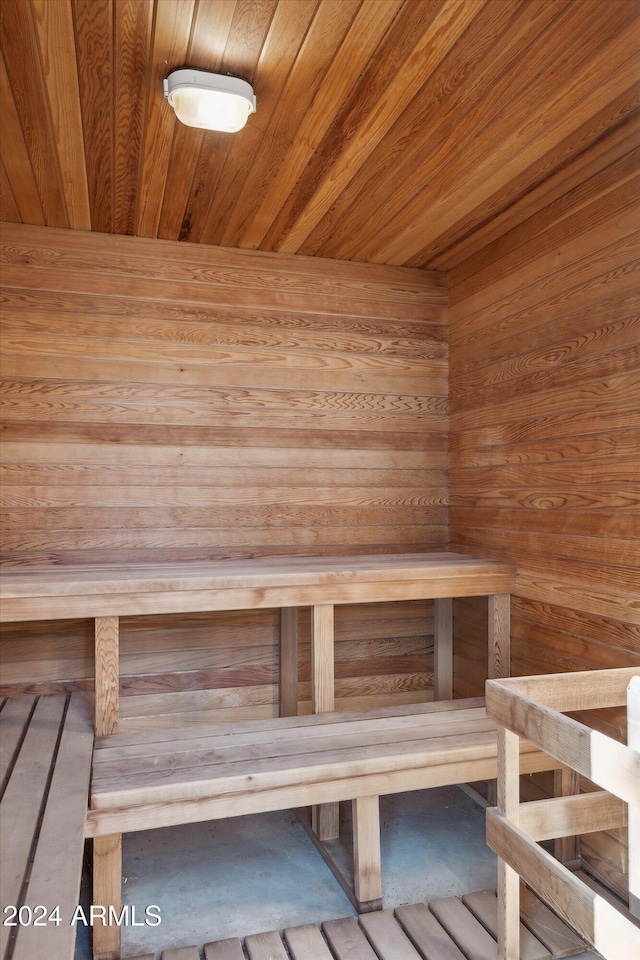 view of sauna / steam room with wood walls and wood ceiling