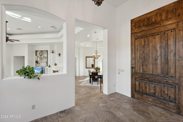 36600 N 50th St, Cave Creek, AZ 85331 - foyer with a chandelier, arched walkways, stone finish floors, a ceiling fan, and recessed lighting