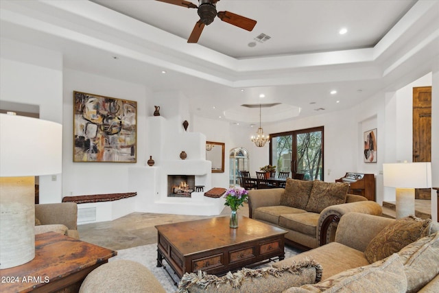 36600 N 50th St, Cave Creek, AZ 85331 - living area featuring a tray ceiling, a chandelier, ceiling fan, recessed lighting, and a lit fireplace