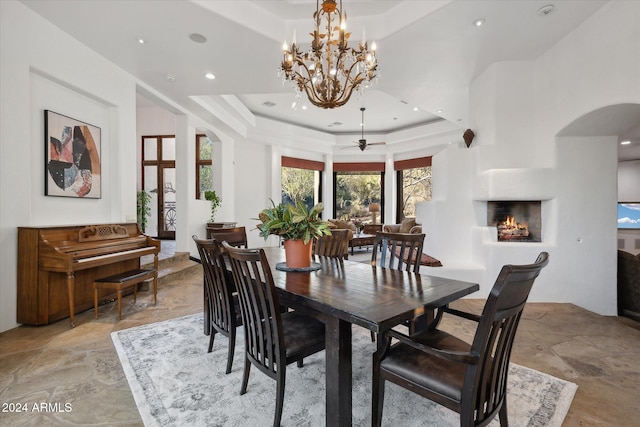 dining room featuring a chandelier and a tray ceiling