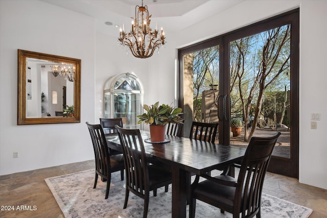 36600 N 50th St, Cave Creek, AZ 85331 - dining space featuring a chandelier and stone tile flooring