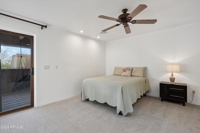 carpeted bedroom with ceiling fan and access to outside