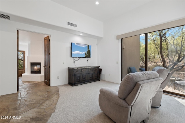 36600 N 50th St, Cave Creek, AZ 85331 - carpeted living room with a lit fireplace and recessed lighting