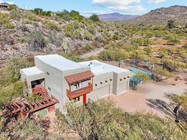 birds eye view of property featuring a mountain view