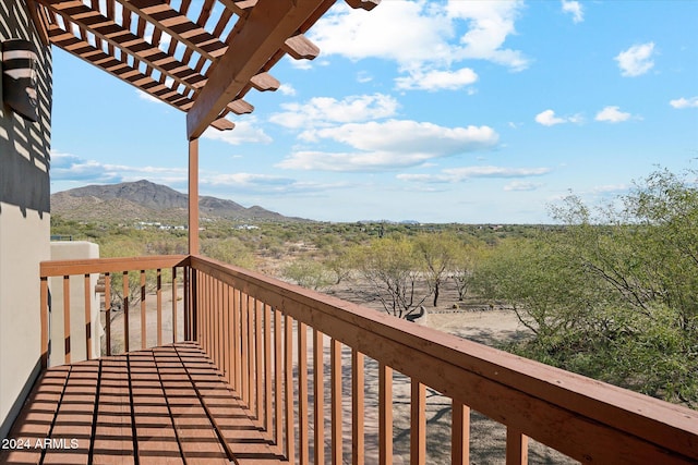 deck featuring a pergola and a mountain view