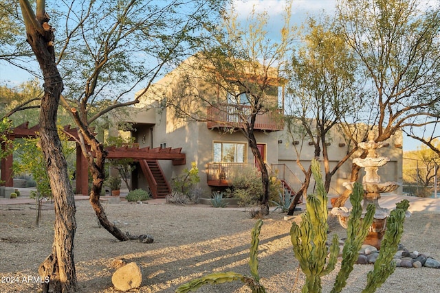 36600 N 50th St, Cave Creek, AZ 85331 - view of front of property with stairway, a balcony, and stucco siding